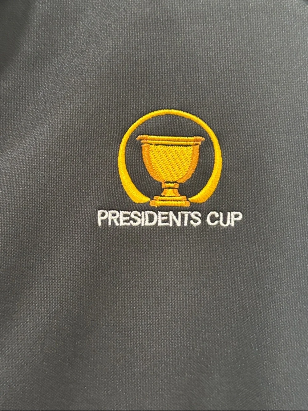 PGA TOUR Black Presidents Cup Sleeveless Zip Vest with Yellow Logo
